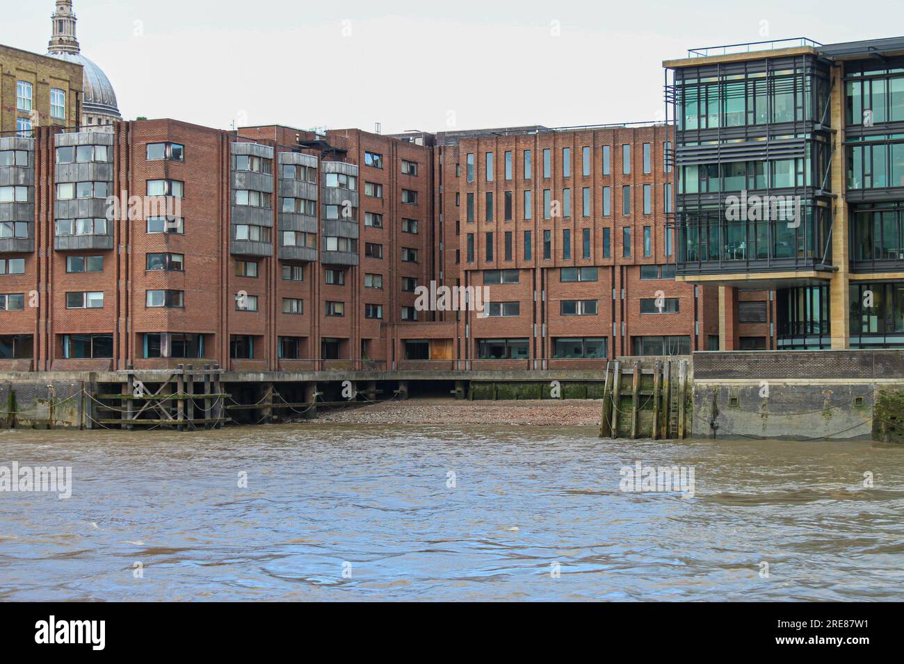 Buildings next to a river against the sky Stock Photo - Alamy