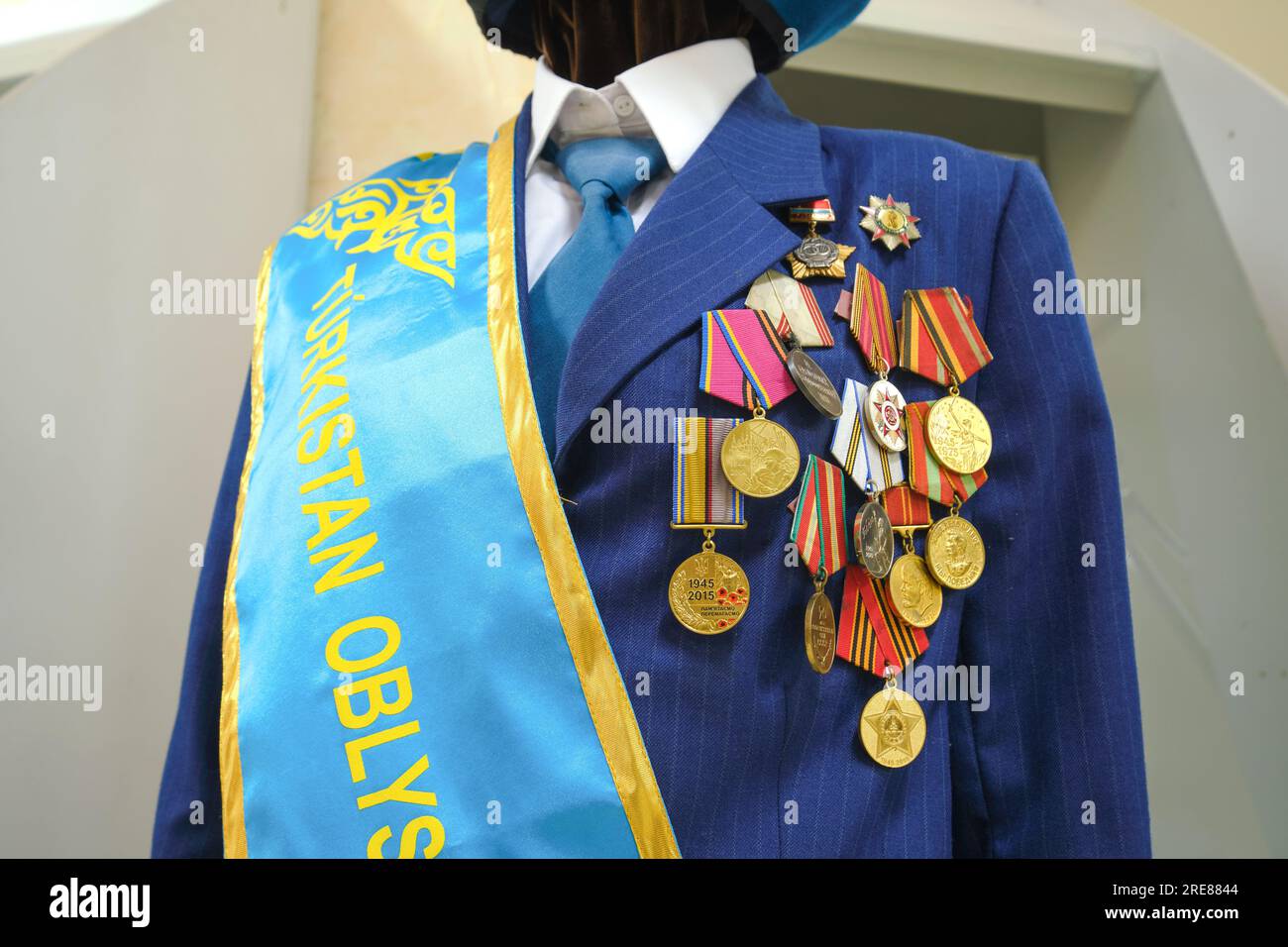 Close up view of a military officer's coat with many, a lot of hanging gold  medals on the chest. At the South Kazakhstan Regional Historical Museum in  Stock Photo - Alamy