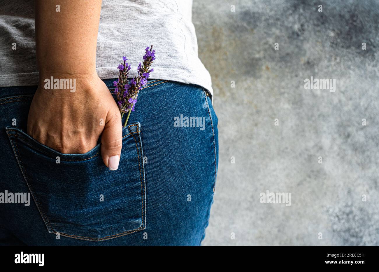 Classic blue jeans with lavender flowers Stock Photo