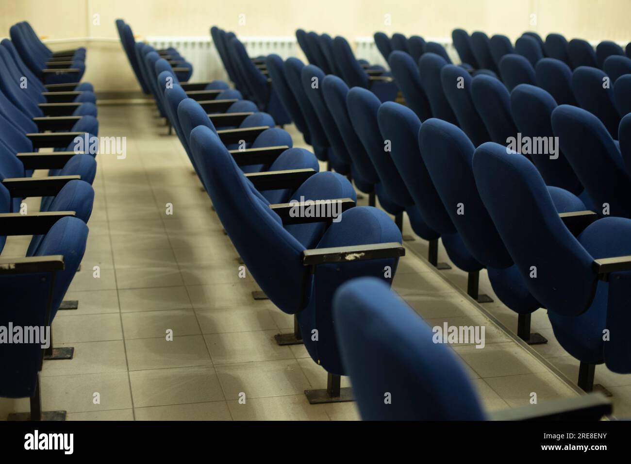 Blue seats in hall. Chairs in cinema. Place to watch movie. Blue