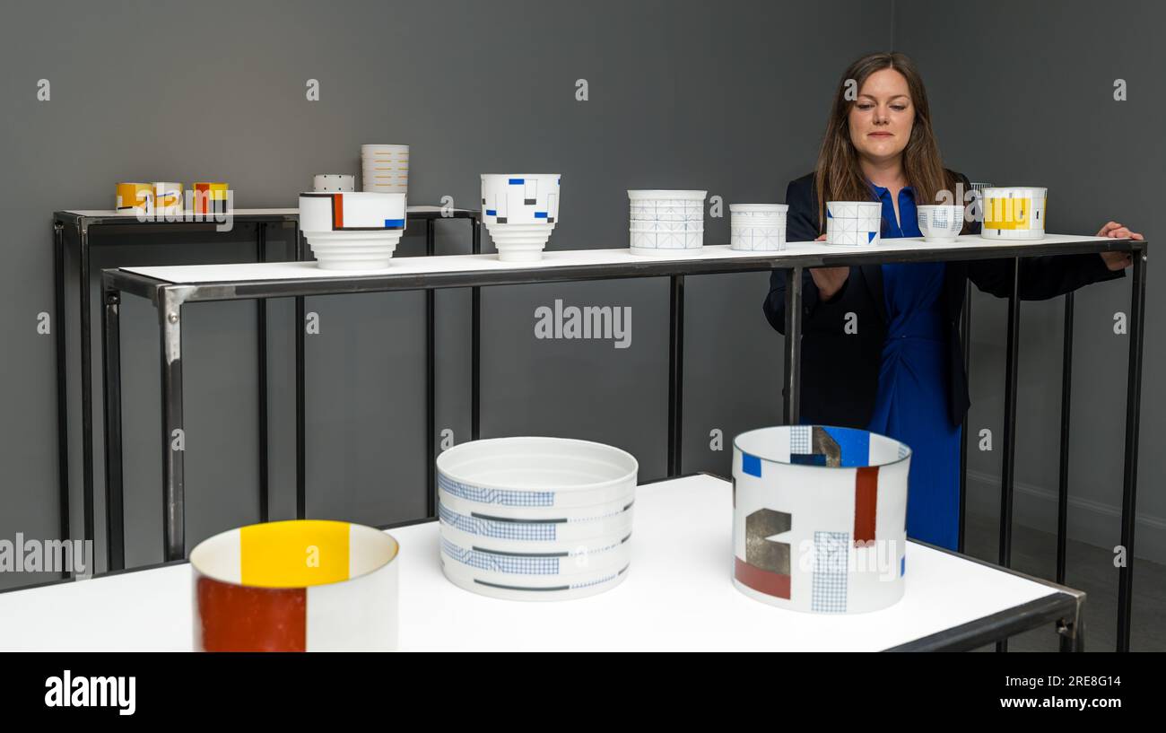 The Scottish Gallery, Edinburgh, Scotland, UK, 26 July 2023, Edinburgh Art Festival: a new exhibition called Wonder Women features ceramic works from internationally acclaimed ceramcist Bodil Manz as part of the Edinburgh Art Festival. Pictured: a member of the gallery staff with fine ceramics by Bodil Manz. Credit: Sally Anderson/Alamy Live News Stock Photo