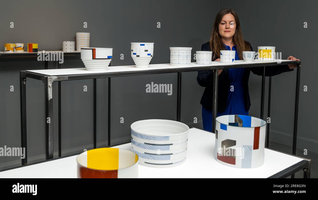 The Scottish Gallery, Edinburgh, Scotland, UK, 26 July 2023, Edinburgh Art Festival: a new exhibition called Wonder Women features ceramic works from internationally acclaimed ceramcist Bodil Manz as part of the Edinburgh Art Festival. Pictured: a member of the gallery staff with fine ceramics by Bodil Manz. Credit: Sally Anderson/Alamy Live News Stock Photo