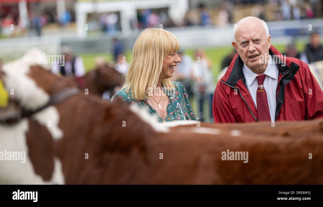 Builth Wells, Royal Welsh Show - 26 July 2023 - Radio DJ Sara Cox judges the beef young handlers class at the Royal Welsh Agricultural Show in Buith Wells, Wales, where, with the help of her father, picked outa pair of Hereford cattle as her Champions with the Longhorns in Reserve. Credit: Wayne HUTCHINSON/Alamy Live News Stock Photo