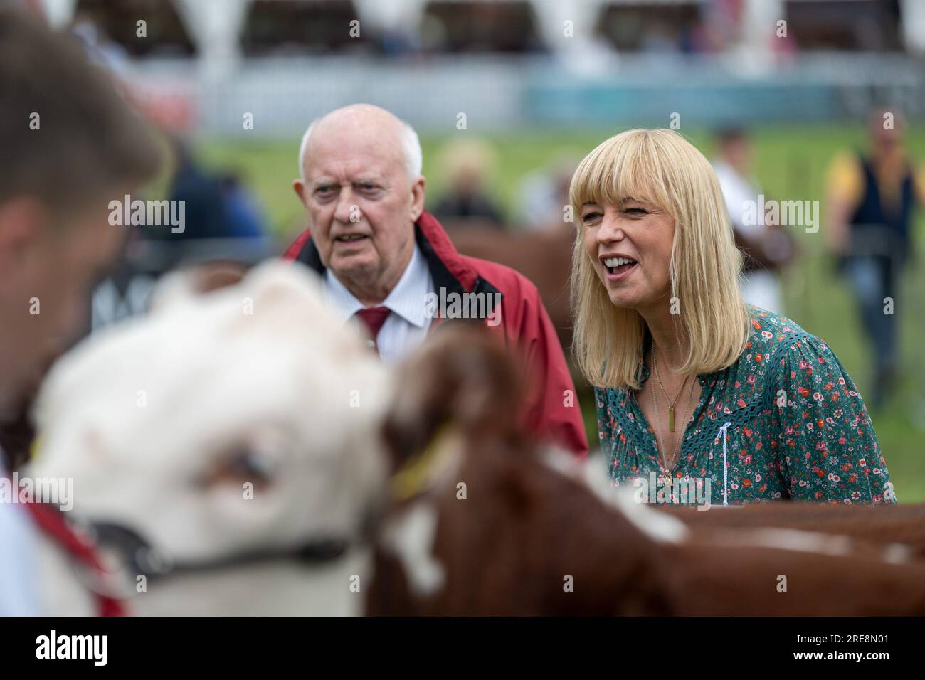 Builth Wells, Royal Welsh Show - 26 July 2023 - Radio DJ Sara Cox judges the beef young handlers class at the Royal Welsh Agricultural Show in Buith Wells, Wales, where, with the help of her father, picked outa pair of Hereford cattle as her Champions with the Longhorns in Reserve. Credit: Wayne HUTCHINSON/Alamy Live News Stock Photo