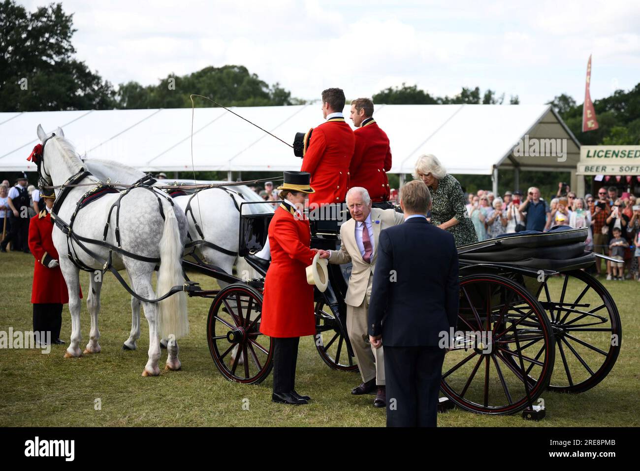 King Charles III and Queen Camilla arrive by horse drawn carriage for a