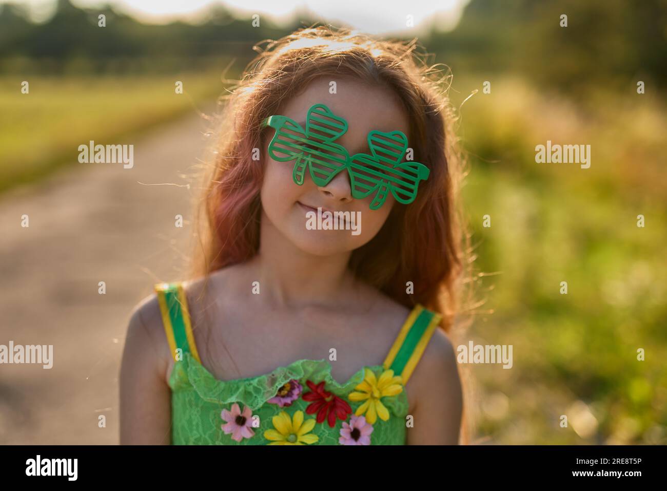 Funny Irish girl with red hair dressed as a fairy for St.Patricks Day