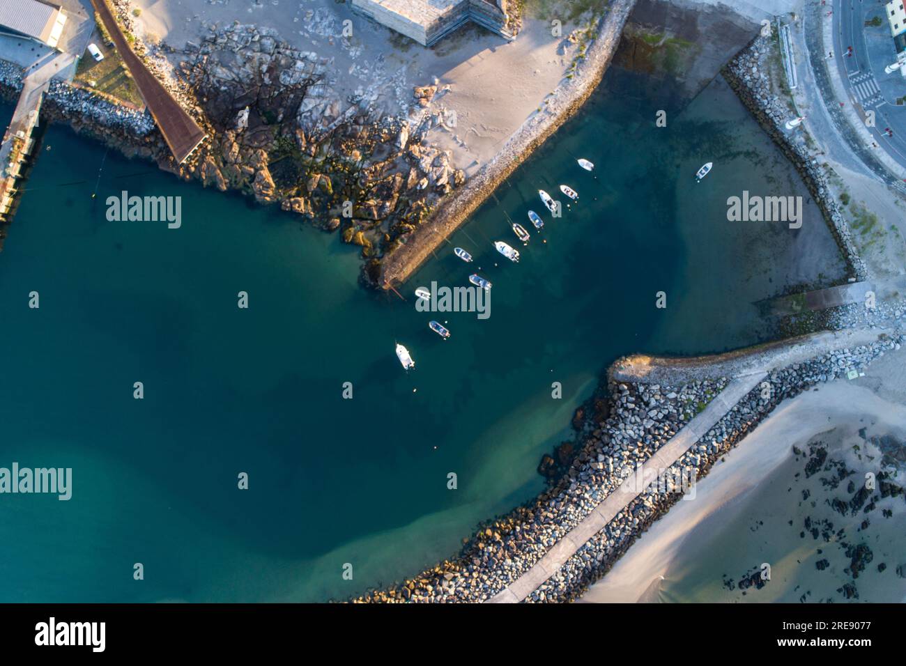 aerial view of ships docked in a harbor with breakwaters Stock Photo ...