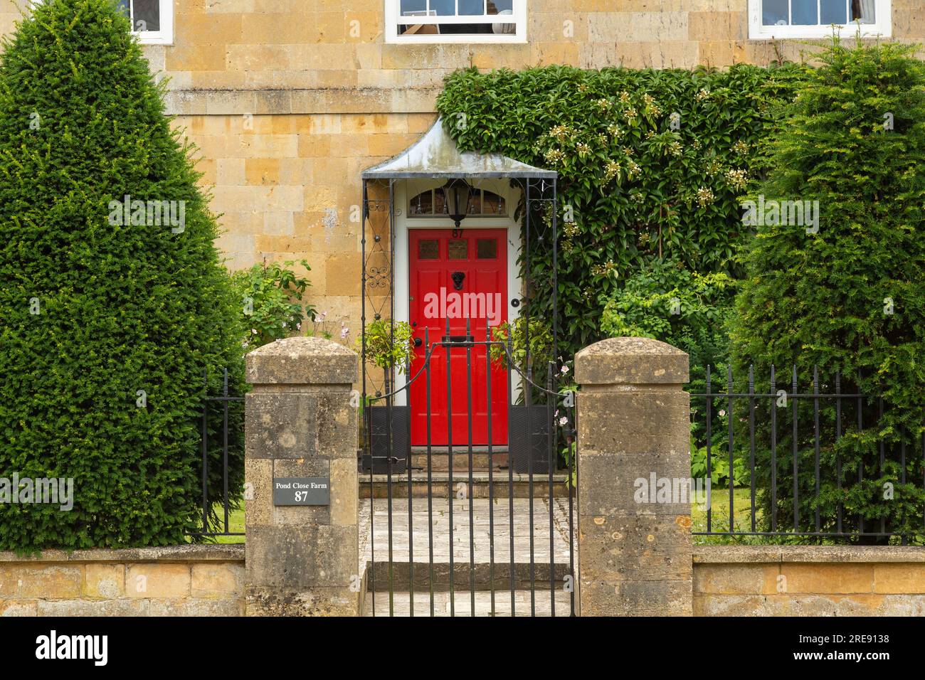 Entrance and door,to a cottage in the village of Broadway, Worcestershire, England, in the Cotwolds Area of Oustanding Natural Beauty. Stock Photo