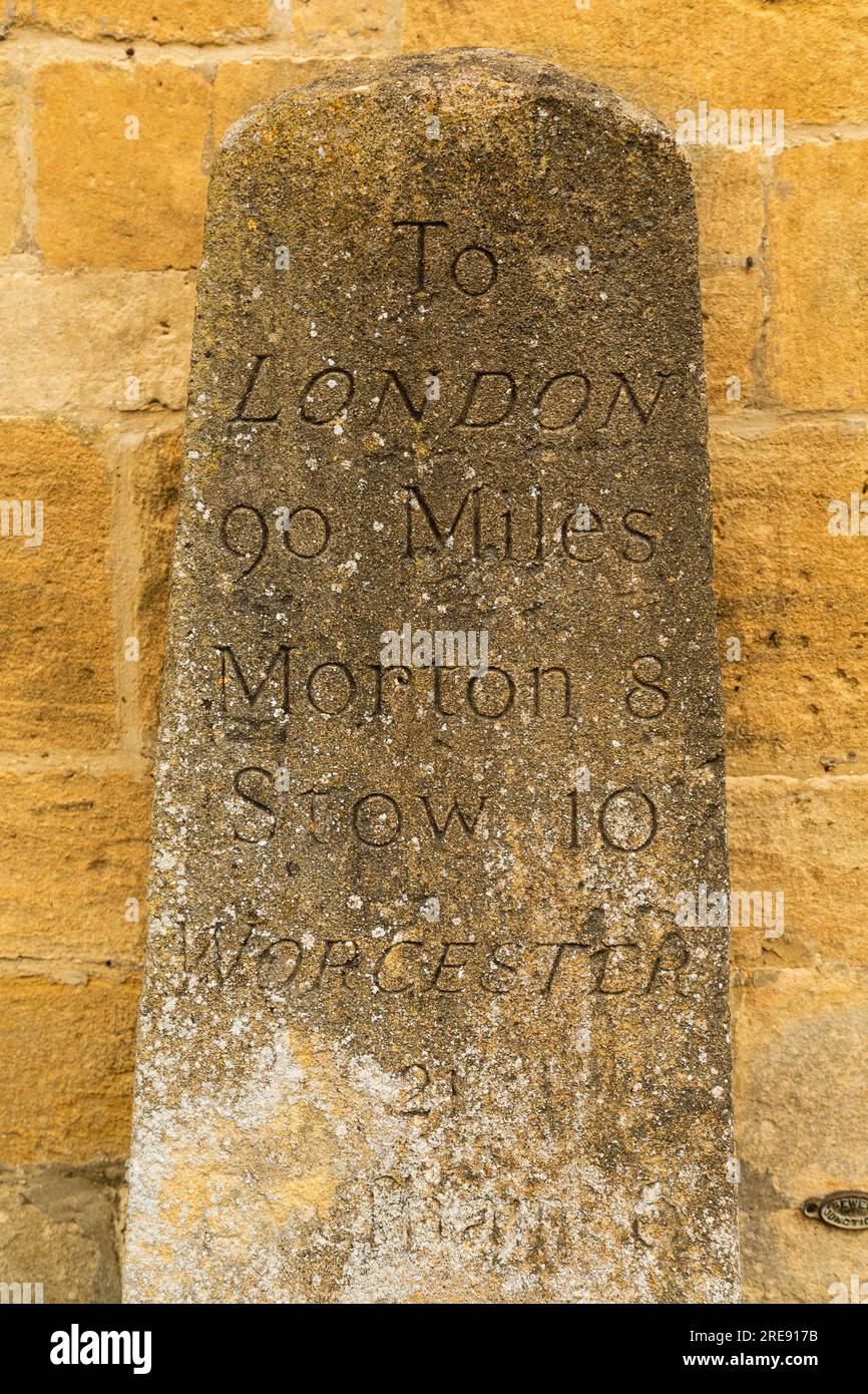 Milestone in the village of Broadway, Worcestershire, England, in the Cotwolds Area of Oustanding Natural Beauty. Stock Photo
