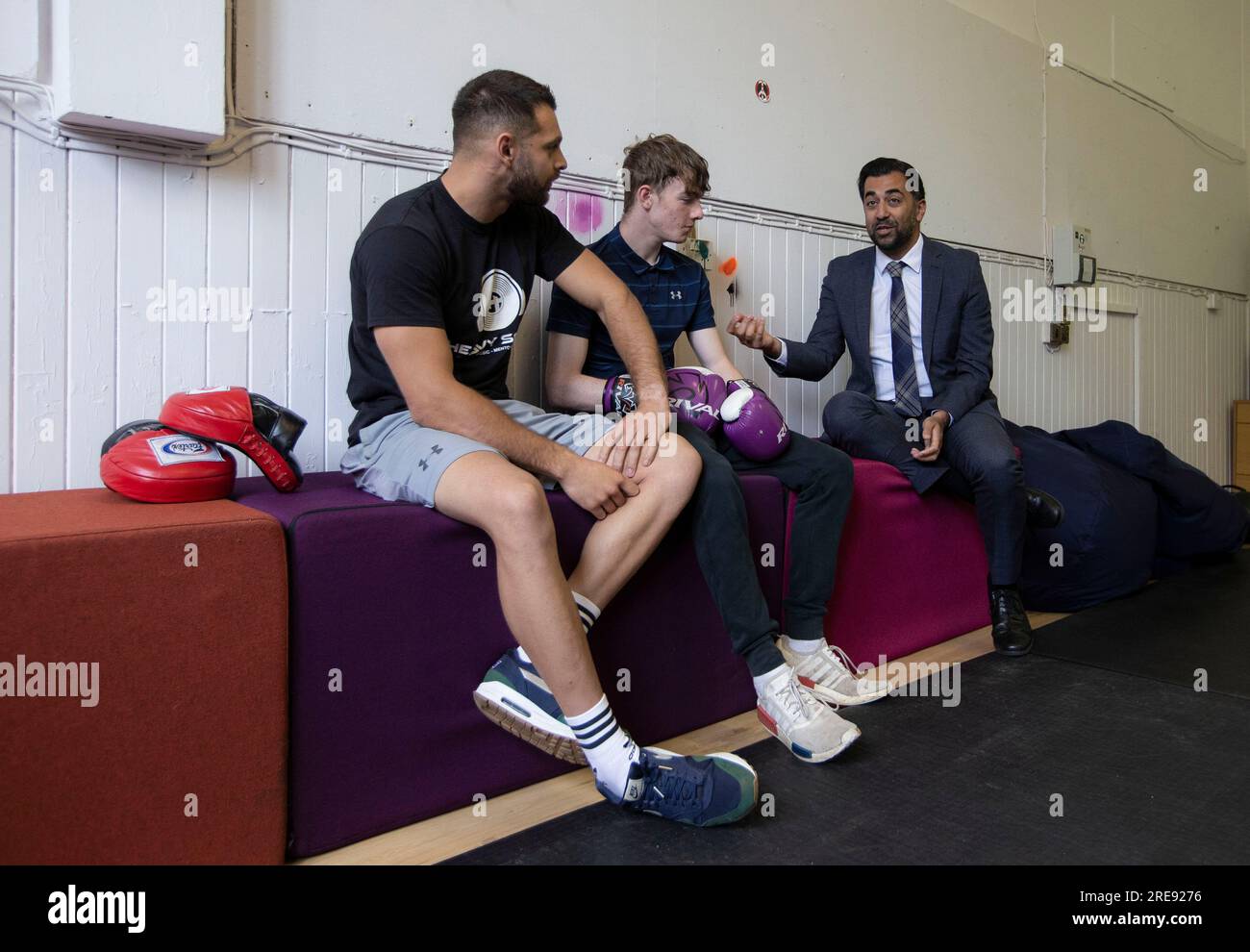 First Minister Humza Yousaf (right) talking with Bradley MacGregor (centre) and Darius Black (left) during a visit to youth organisation, Heavy Sound in Cockenzie, East Lothian, which aims to transform the lives of vulnerable and disengaged young people and adults across East Lothian, Midlothian and Edinburgh. Picture date: Wednesday July 26, 2023. Stock Photo