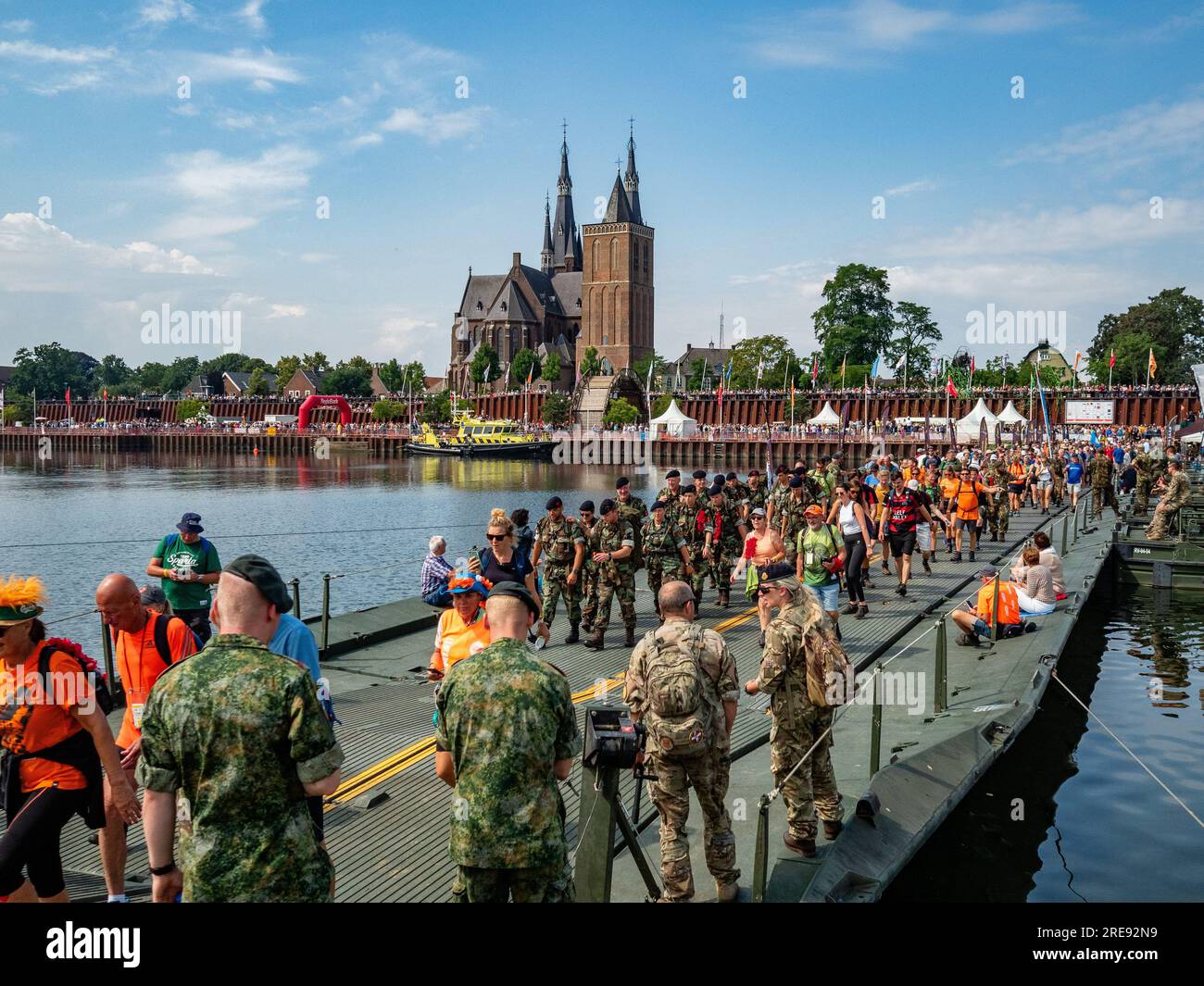 July 21, 2023, Cuijk, Netherlands: Walkers are seen crossing the ''Pontoon Bridge'', a bridge that each year is created for this event. Since it is the worldâ€™s biggest multi-day walking event, The International Four Days Marches (in Dutch 'De Vierdaagse') is seen as the prime example of sportsmanship and international bonding between military servicemen, women and civilians from many different countries. This year, it was the 105 edition and the official amount of walkers registered was 43,363 from 77 countries. Participants can choose to walk 30km, 40km, or 50km per day. On the last day, 39 Stock Photo
