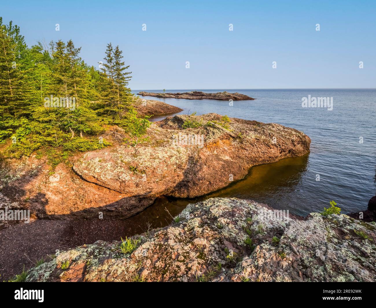 Rocky shoreline Lake Superior on the Keweenaw Peninsula between Eagle RIver and Copper Harbor in Upper Michigan USA Stock Photo