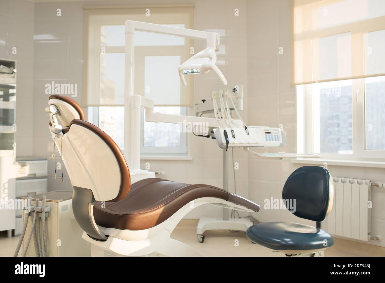 Nobody in clean modern dentists office leather dental chair and