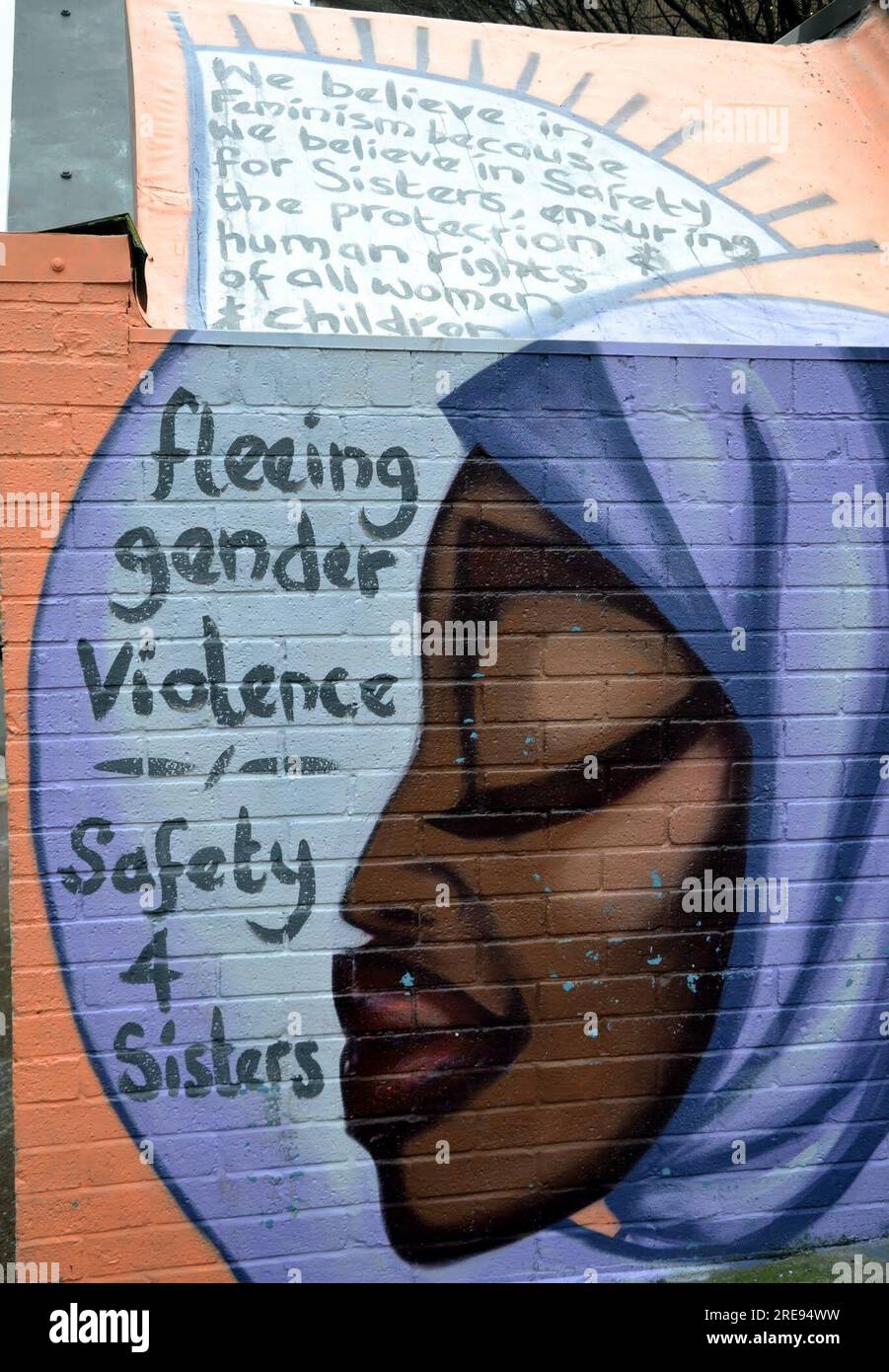 street art, painting on old wall in northern quarter, message is fleeing gender violence, safety 4 sisters, urban art, archival: Manchester, UK, Stock Photo