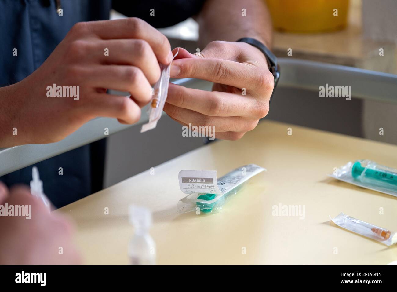 Coburg, Germany. 23rd July, 2023. A nursing student unpacks the needle for an injection. This week, the first graduates in generalist nursing in Bavaria will receive their graduation certificates. Credit: Pia Bayer/dpa/Alamy Live News Stock Photo