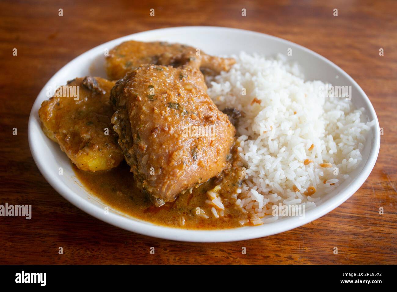 Pepian de cuy is a hearty stew made with guinea pig meat and corn and seasoned with peppers, onions and peanuts. Stock Photo