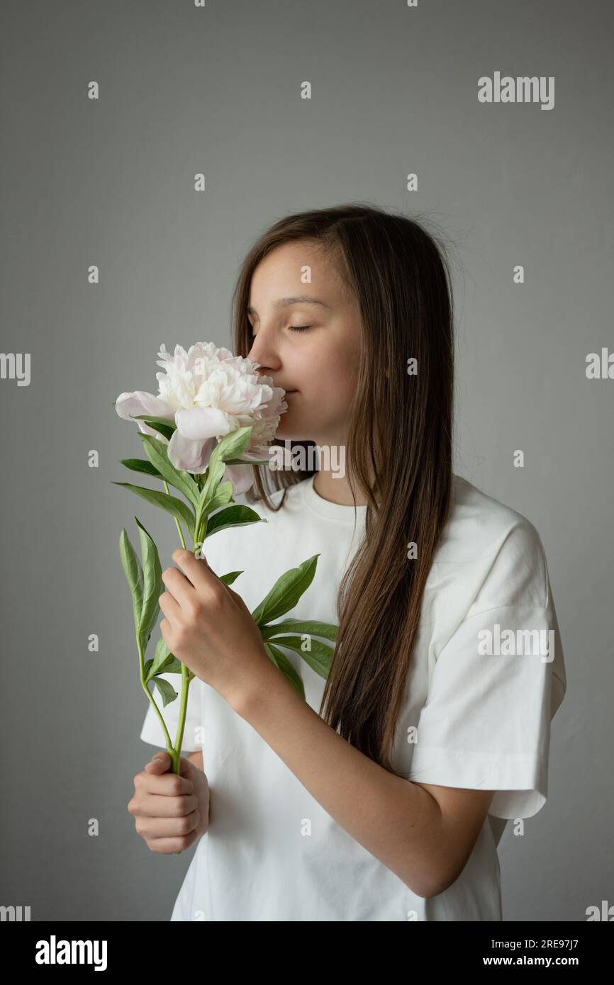 Portrait of side view of dreamy preteen girl child with long hair eyes ...