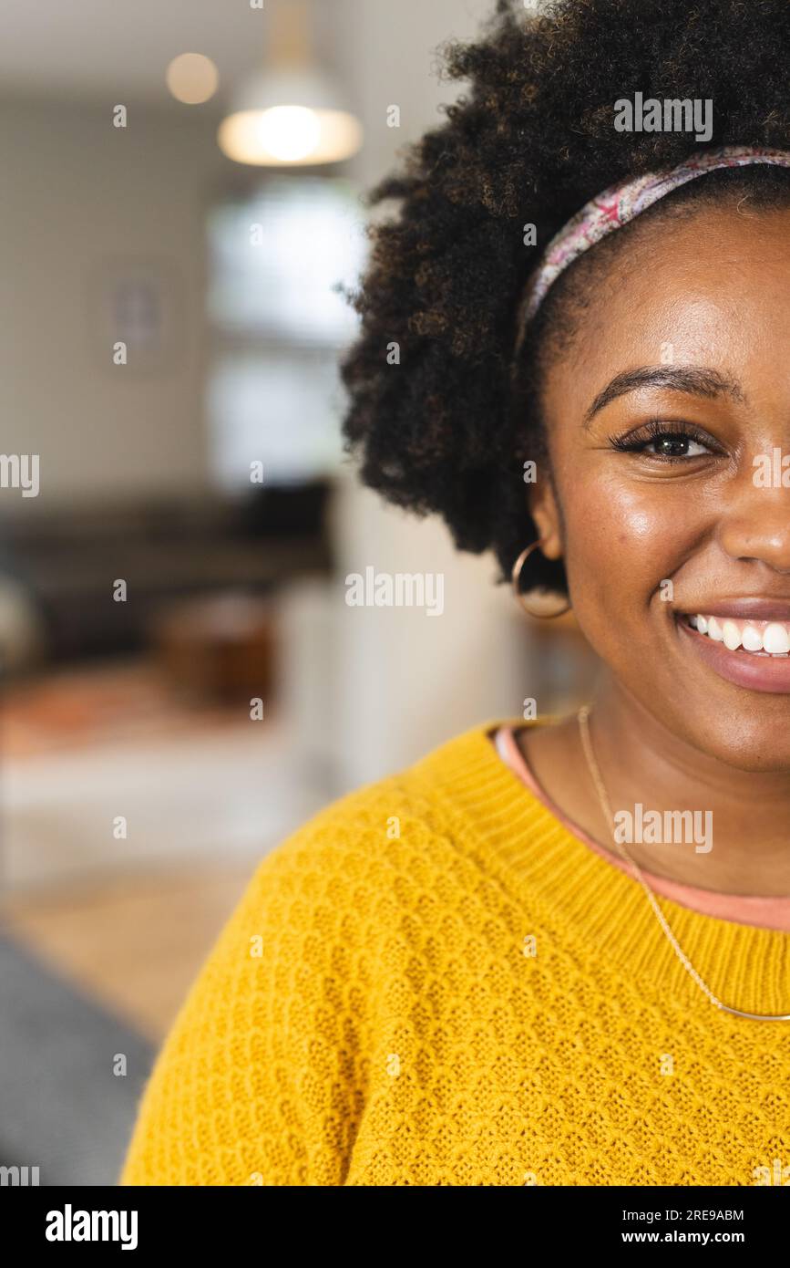 Woman in yellow sweater wearing hi-res stock photography and images - Alamy