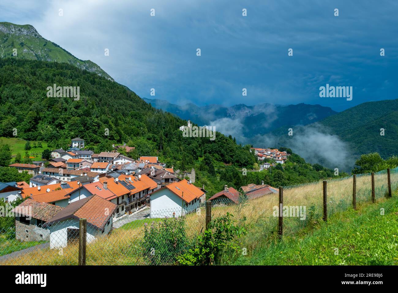 The village of Rivalpo, hamlet of Arta Terme, placed at 900 meters a.s.l. on the alps of Carnia in Italy Stock Photo