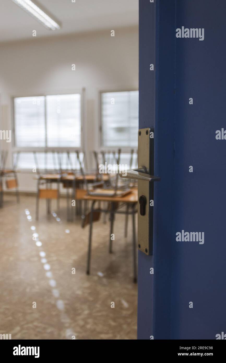 The door open of a school, with the tables in the background, back to school Stock Photo