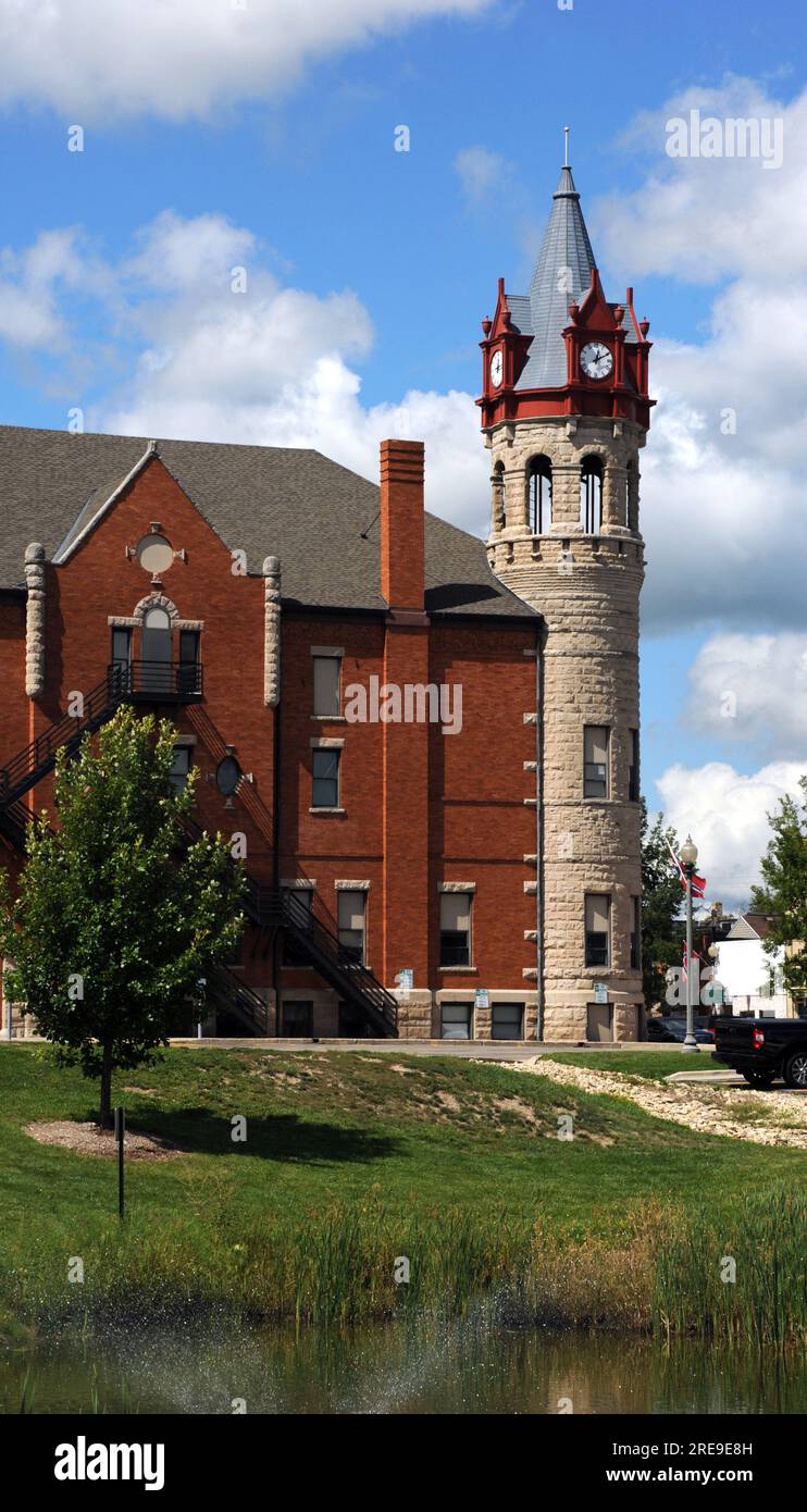 Side view of the Stoughton, Wisconsin, Opera House and City Hall. Round tower houses four clocks