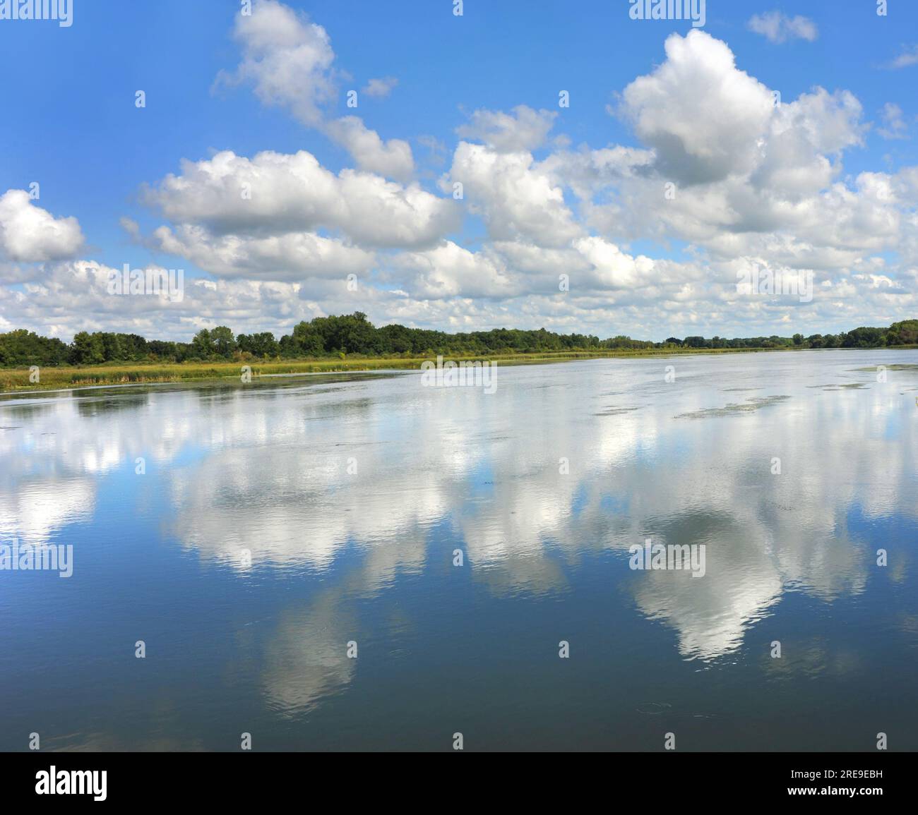 Reflection of sky and clouds causes you to see double, as the surface of the Yahara River serves