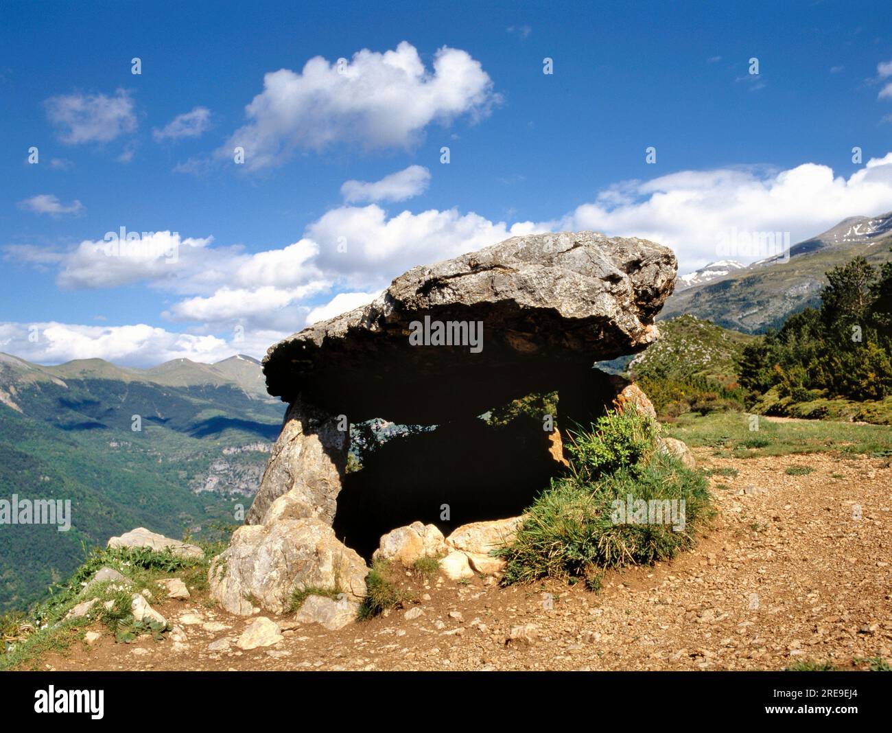 The Dolmen are megalithic burial mounds called a tumulus, a long barrow form of dolmen, dating from 3750–3650 BCE approximately. Near Antequera, Málag Stock Photo