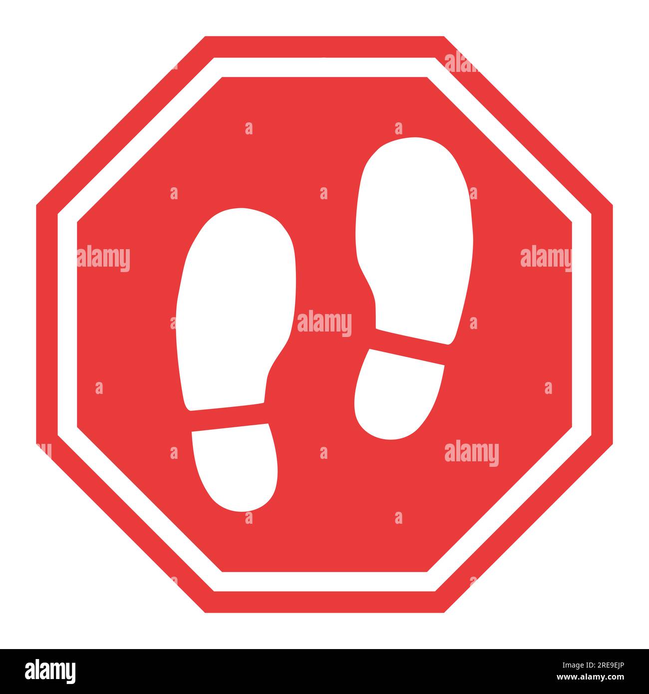 a close up of a stop sign with a pair of shoes in the middle Stock ...