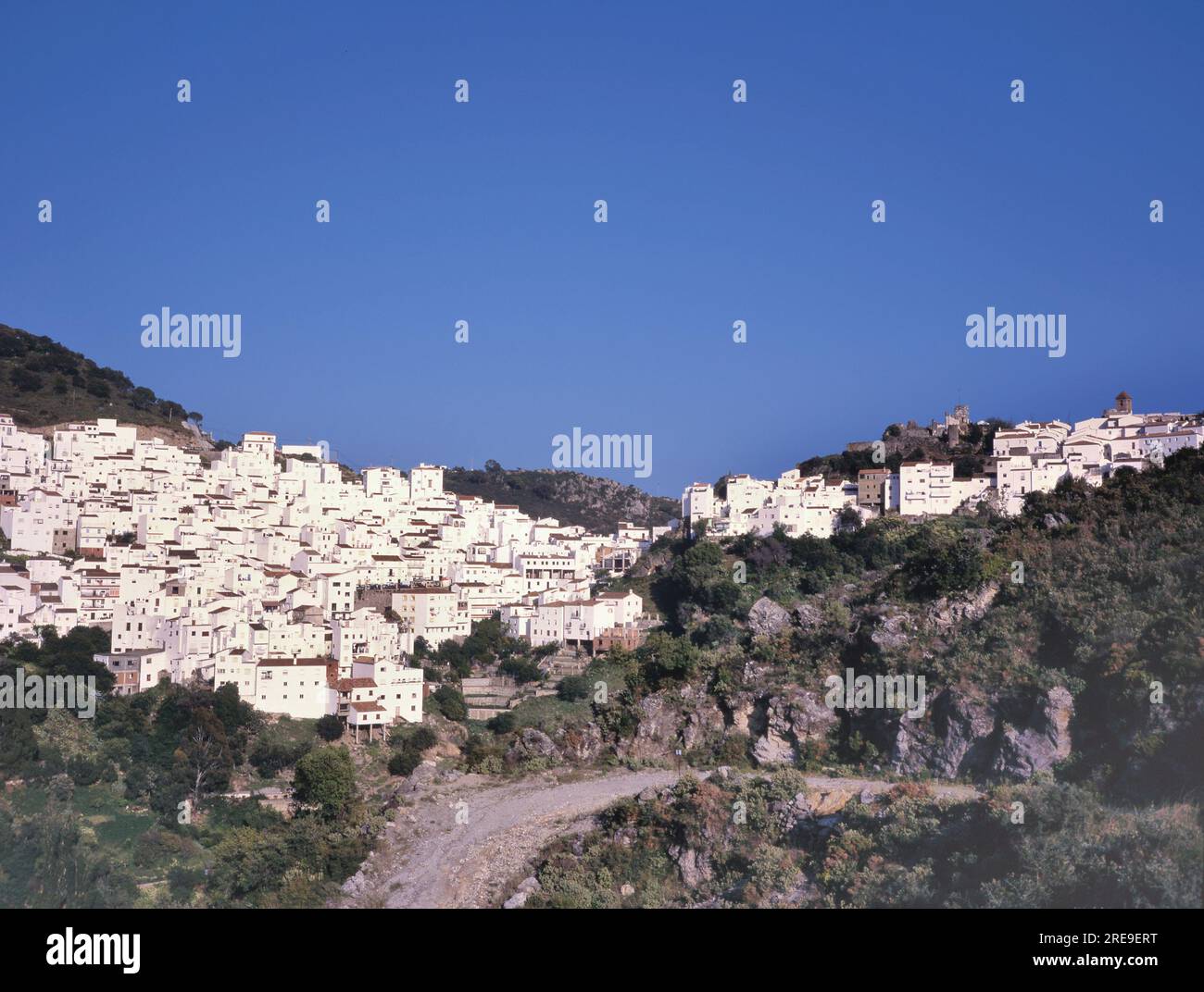 Alcala de los Gazules, white village in Spain with church in the background and clear blue sky, Cadi Stock Photo