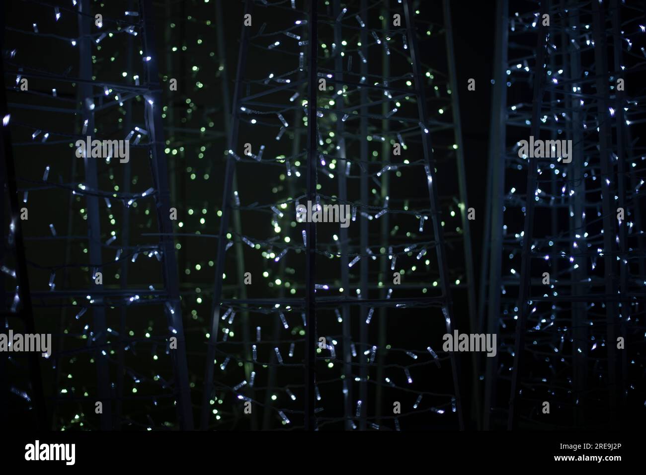 LEDs in dark. White light bulbs glow on black background. Construction