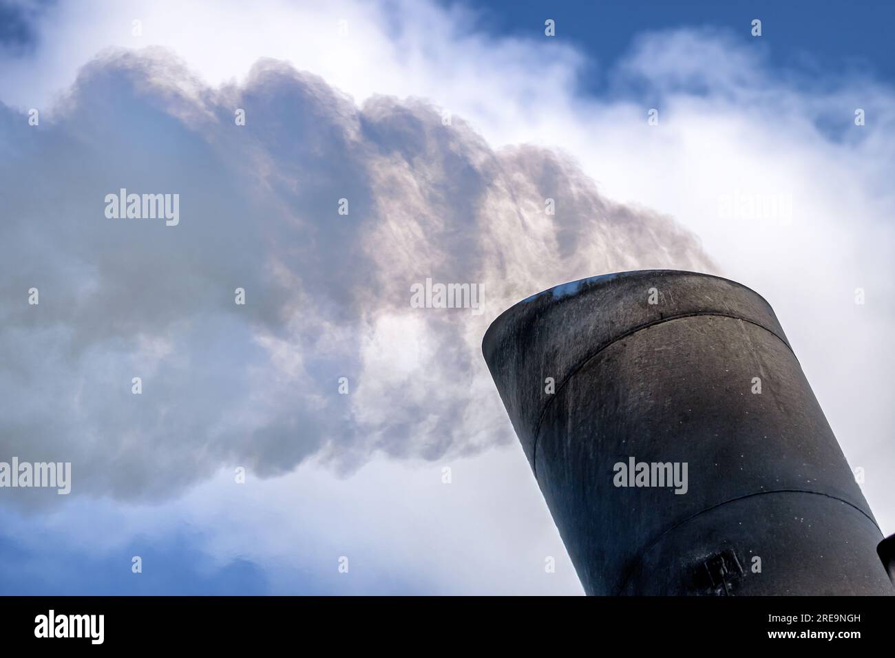 Exhaust emissions coming from a ship's funnel. Stock Photo
