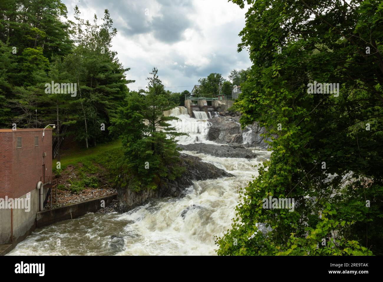 The Waits River Falls are seen in the quaint town of Bradford, Vermont. The waterfall is formed by a dam along the Waits River, a tributary of the Con Stock Photo