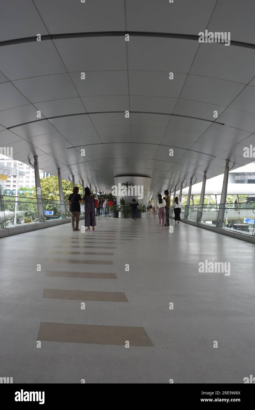 BTS skywalk over busy road in business district in Bangkok, Thailand Stock Photo