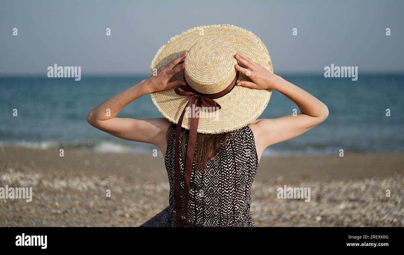 Woman large sun hat legs hi-res stock photography and images - Alamy