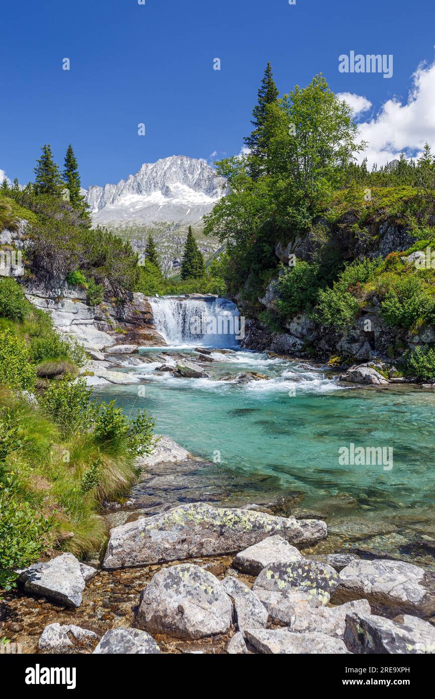 River Chiese, waterfall. Val di Fumo alpine valley. Carè Alto mountain peak. Trentino. Italian Alps. Europe. Stock Photo