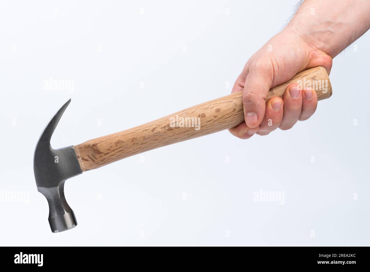 Hand hold wooden hammer handle isolated on white studio background