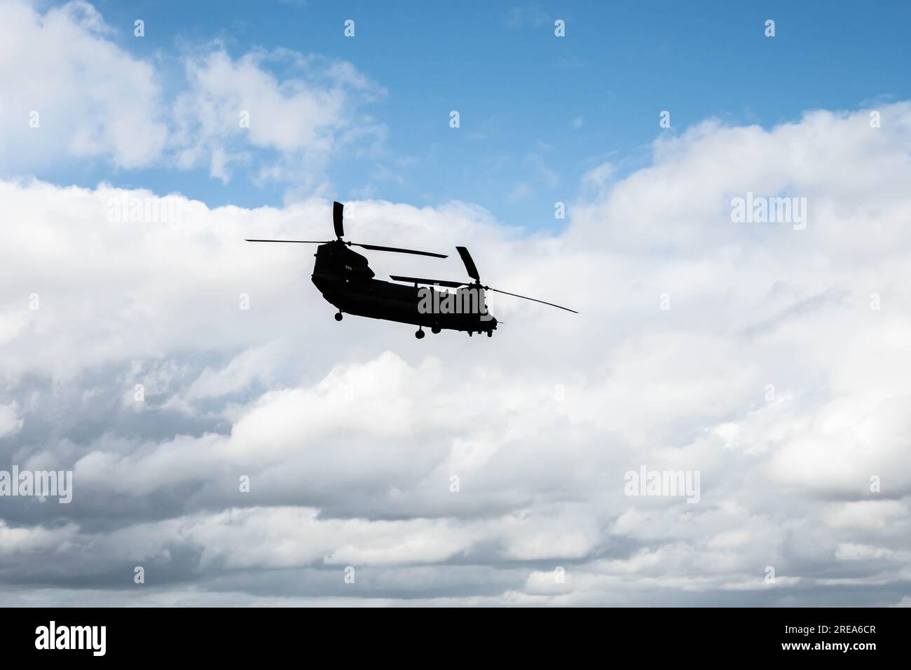 Silhouette of a Boeing V-22 Osprey aircraft on a blue sky Stock Photo