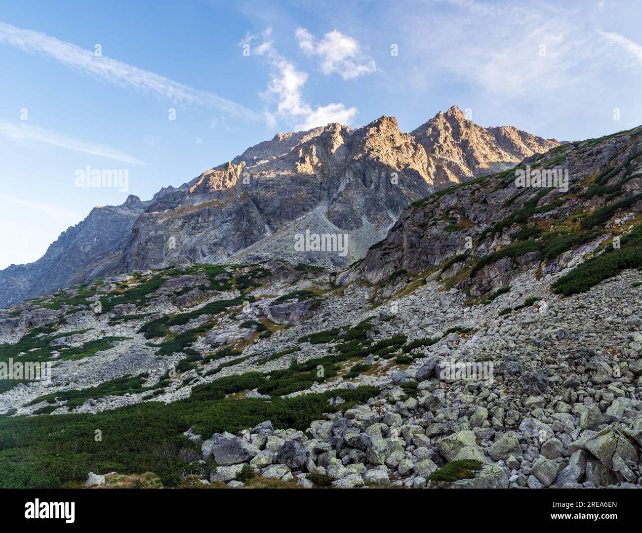 View from hiking trail from Zbojnicka chata to Priecne sedlo in High Tatras mountains in Slovakia during late summer evening Stock Photo