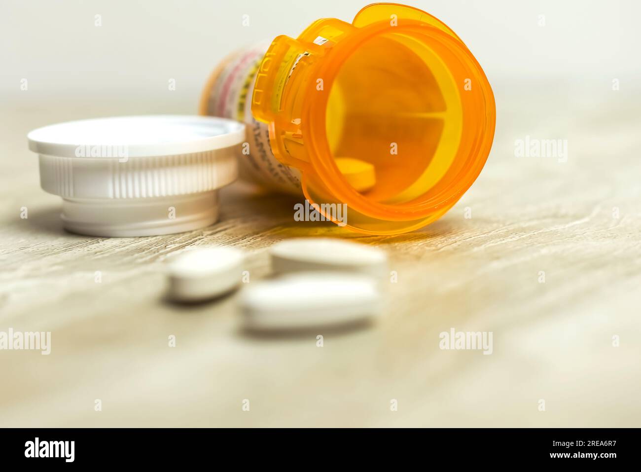 Amoxicillin/Clavulanic Acid 500 mg tablets with orange prescription bottle Stock Photo
