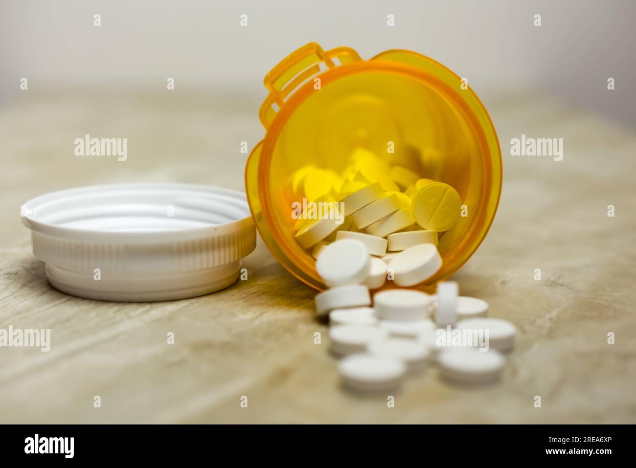 Acetaminophen 500 mg tablets with orange bottle Stock Photo