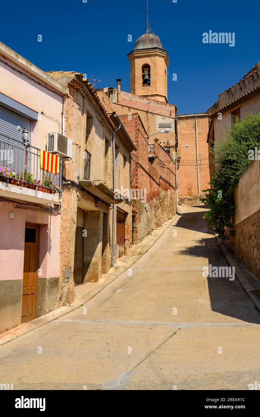 Street and church of Saint Joseph, in Bovera, on a spring morning (Les Garrigues, Lleida, Catalonia, Spain) ESP: Calle e iglesia de Bovera (Lérida) Stock Photo