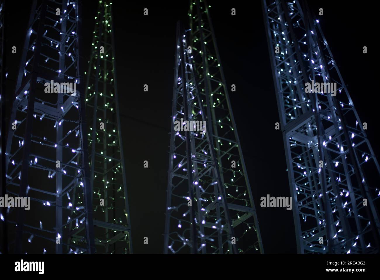LEDs in dark. White light bulbs glow on black background. Construction