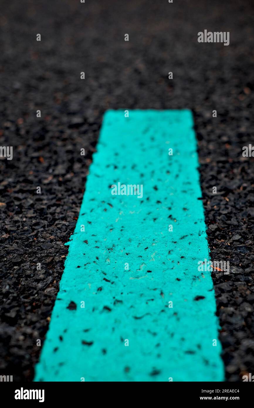 Vertical blue road marking wide stripe in perspective Stock Photo Alamy