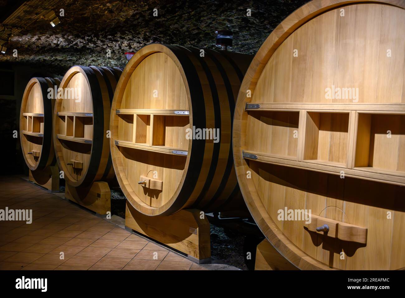 Underground wine cellars with barrels for aging of red dry wine in