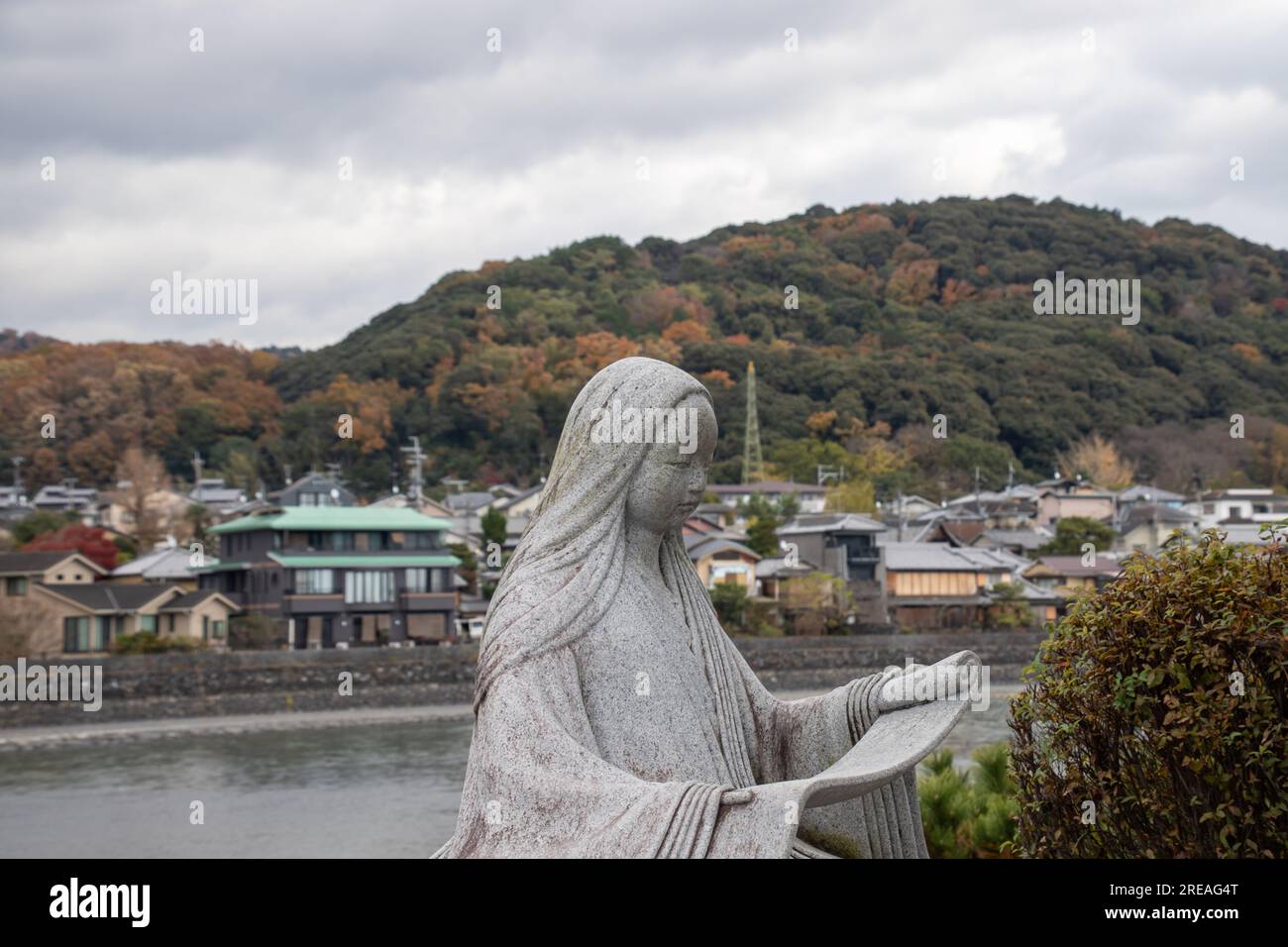 Statue of a Japanese novelist, poet and lady-in-waiting at the court in the Heian Era Murasaki Shikibu at Uji River. The author of The Tale of Genji Stock Photo