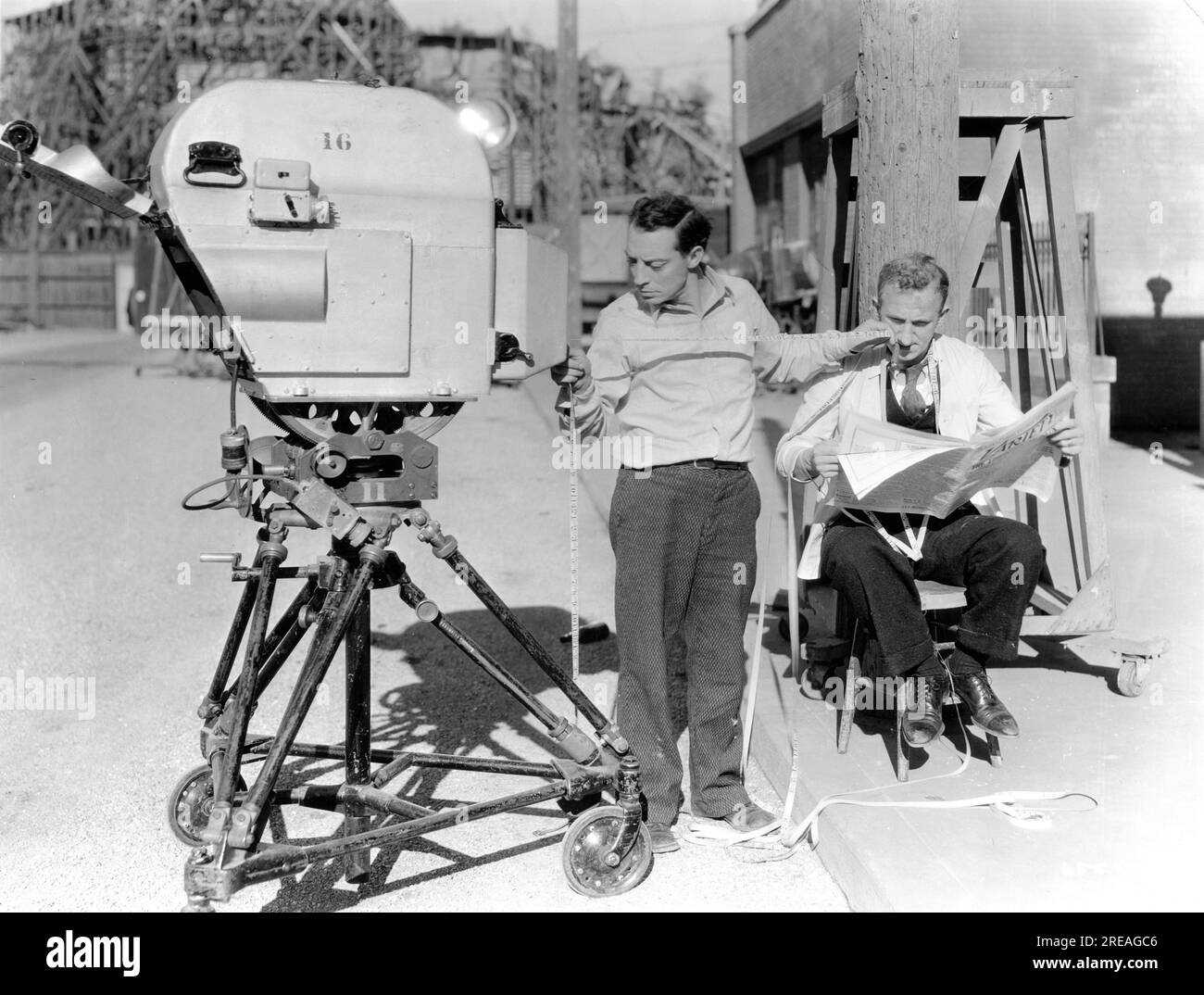 BUSTER KEATON and JIMMY DURANTE gag publicity pose with movie camera on