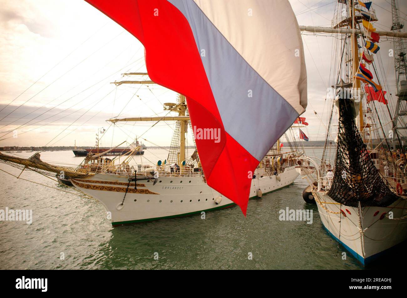 AJAXNETPHOTO. 3RD JULY, 2005. PORTSMOUTH, ENGLAND - INTERNATIONAL FESTIVAL OF THE SEA 2005 - MORE THAN 35 TALL SHIPS TOOK PART IN IFOS 2005. HERE, THE NORWEGIAN SAIL TRAINING VESSEL SORLANDET PREPARES TO SAIL FROM ALONGSIDE THE MONTENEGRAN TALL SHIP JADRAN. PHOTO:JONATHAN EASTLAND/AJAX REF:R50307 440 Stock Photo