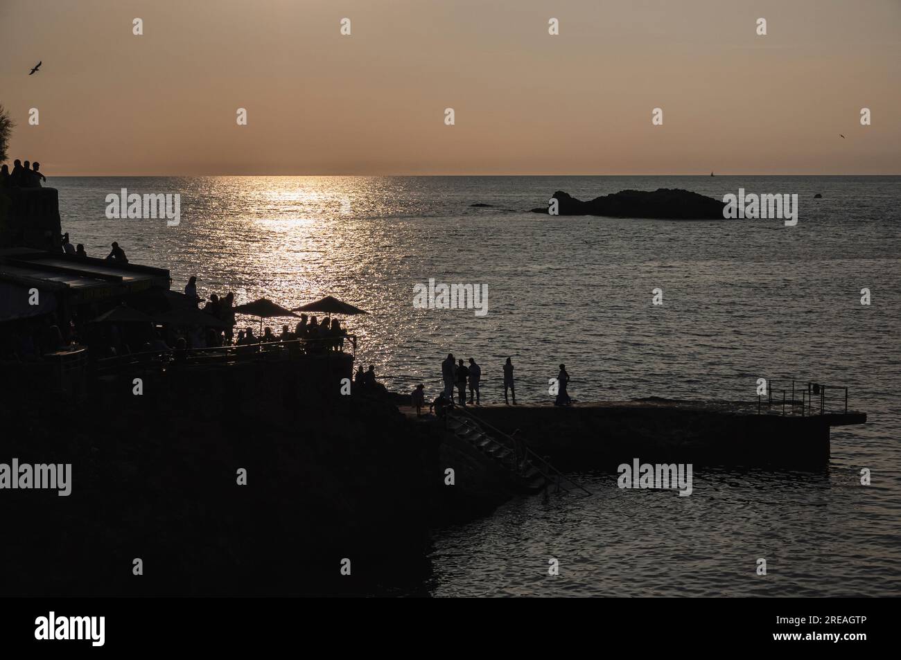 Photo of 'Rocher de la Vierge' in Biarritz on a summer afternoon with a beautiful sunset. Stock Photo