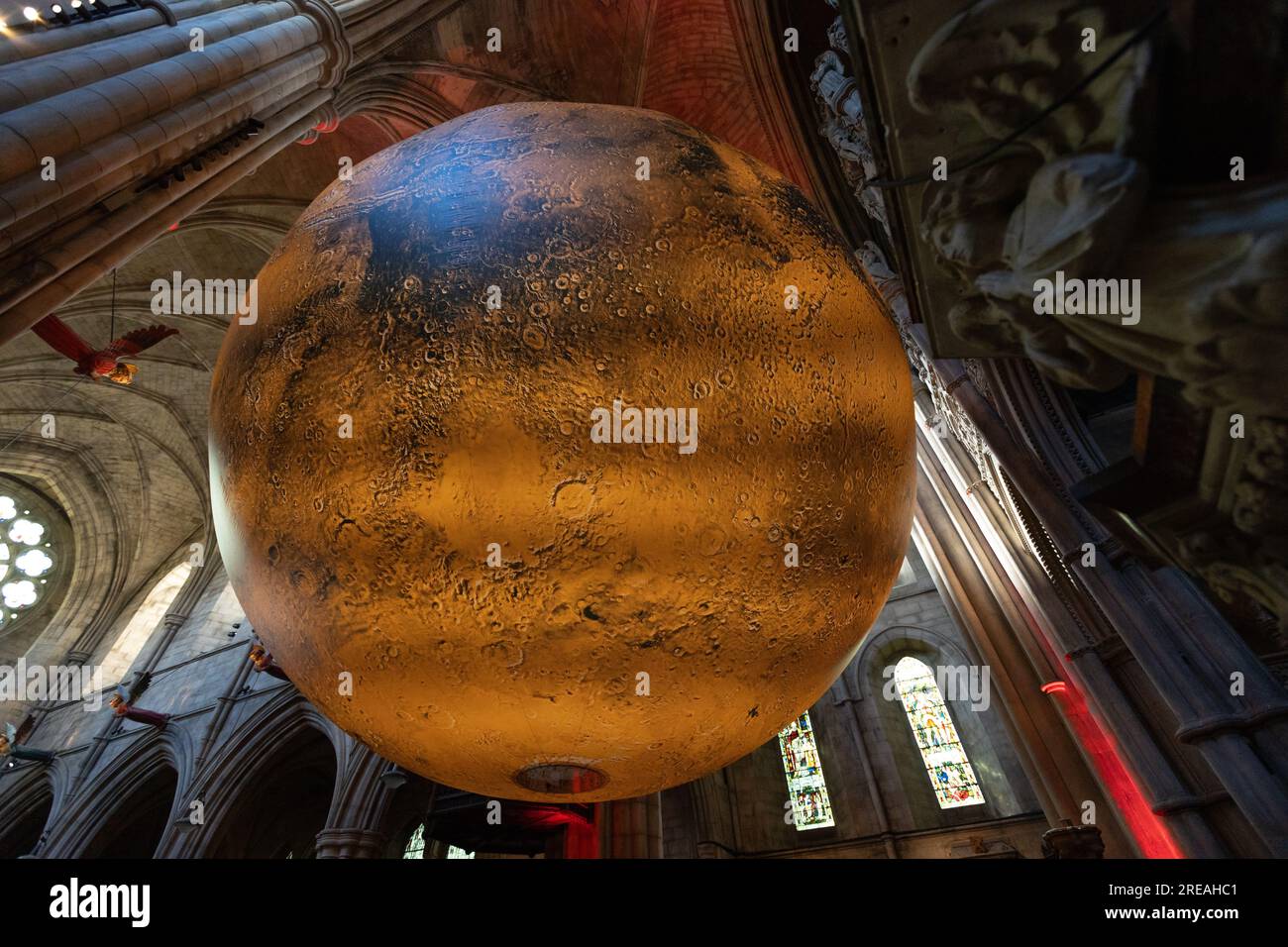 LONDON, UK - JULY 25, 2023, Mars: War and Peace, a touring artwork by Luke Jerram is on display until the 30th of July in St John the Baptist Church. Stock Photo