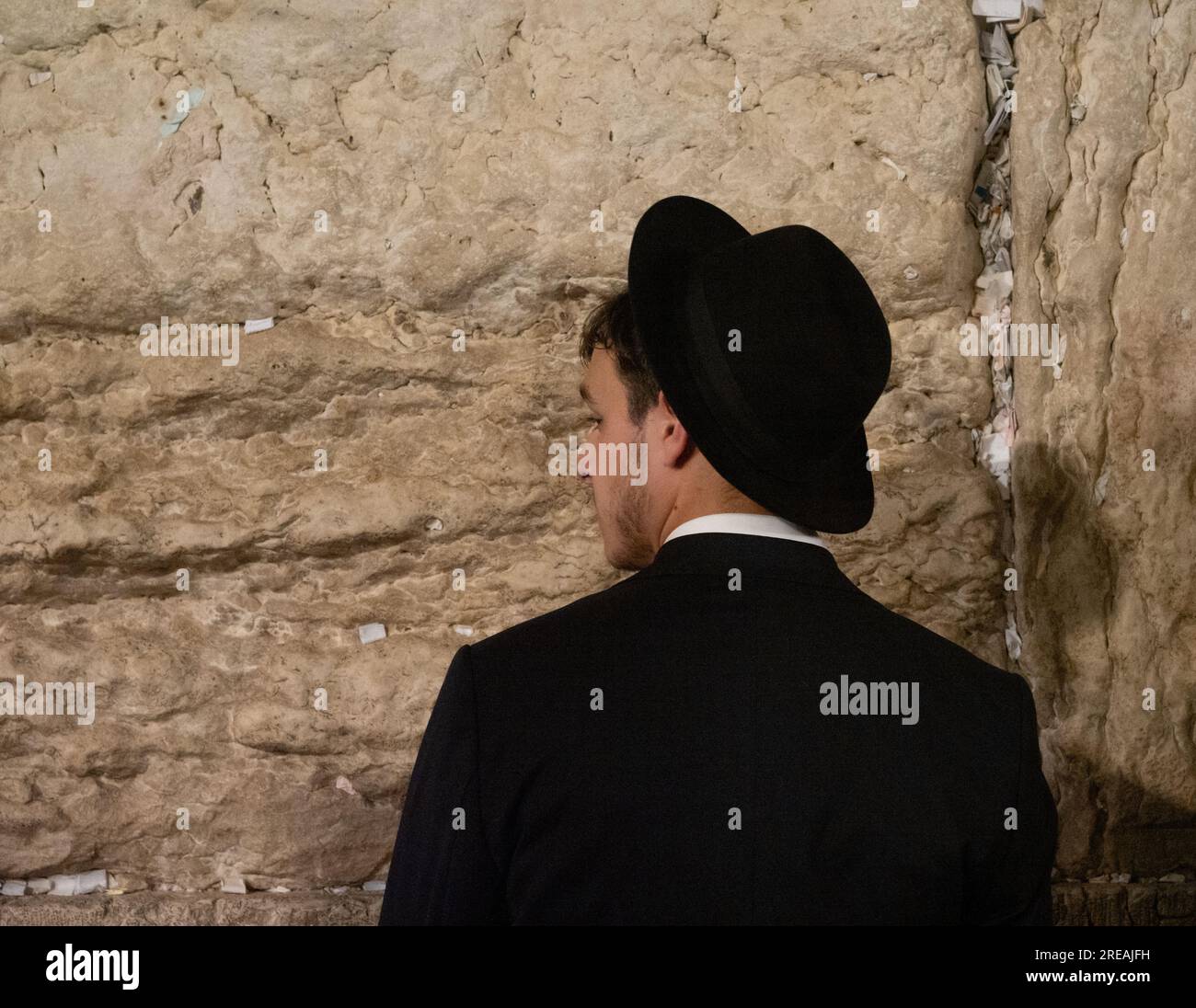 Jerusalem, Israel. 26th July, 2023. An Ultra-Orthodox man praying during Tisha B'Av memorial day in the Western Wall in Jerusalem. © Valentin Sama-Rojo/Alamy Live News. Stock Photo